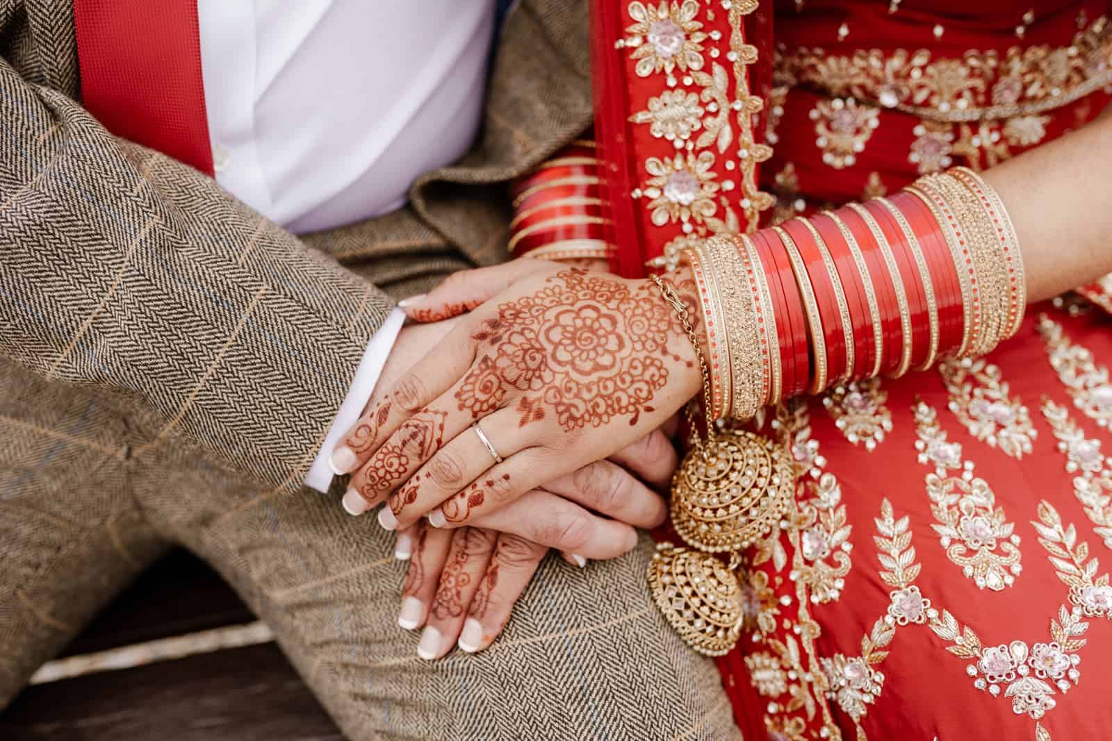 Oakley hall asian wedding with henna on hands
