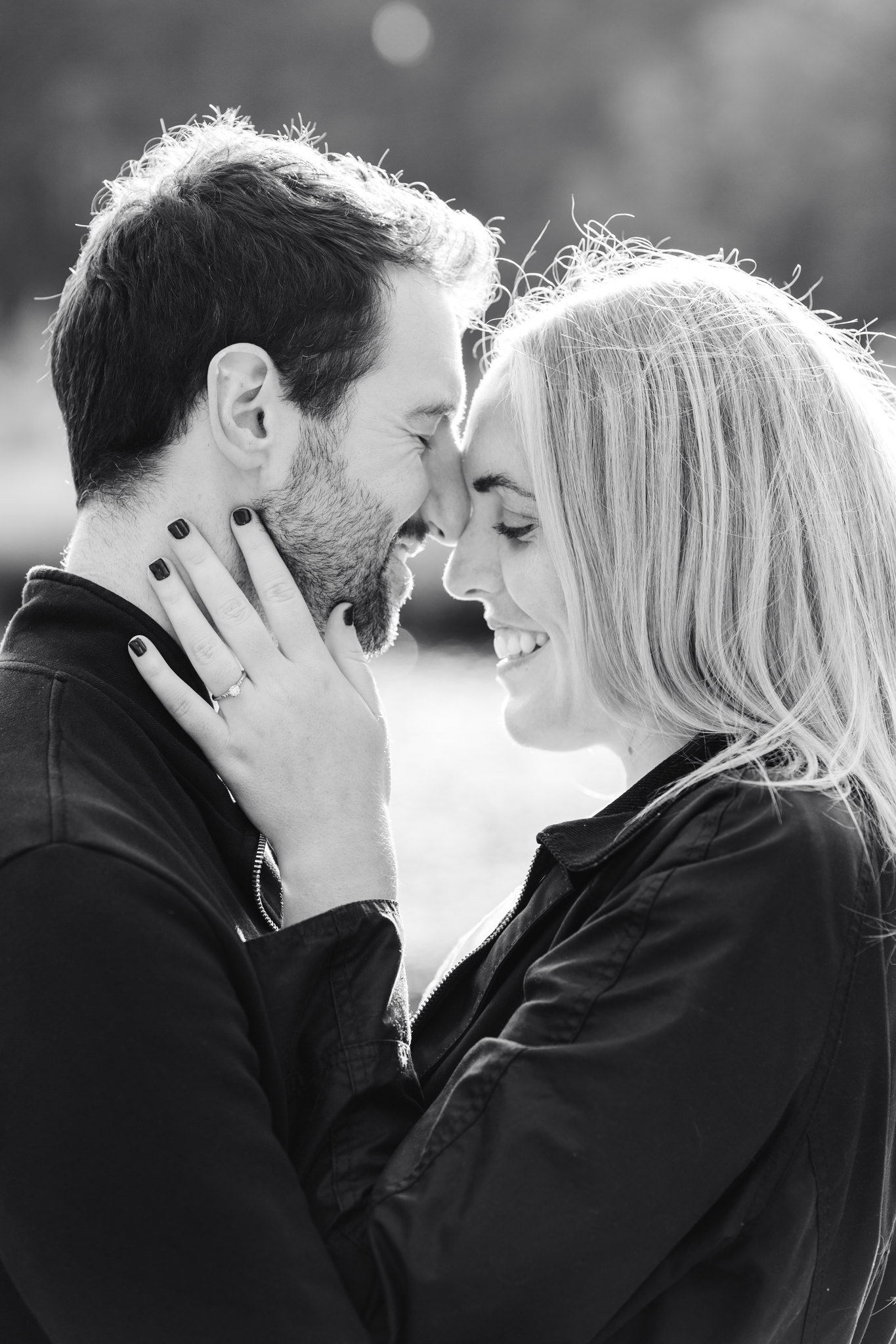 black and white portrait of a couple leaning into one another during an engagement photography session in hampshire