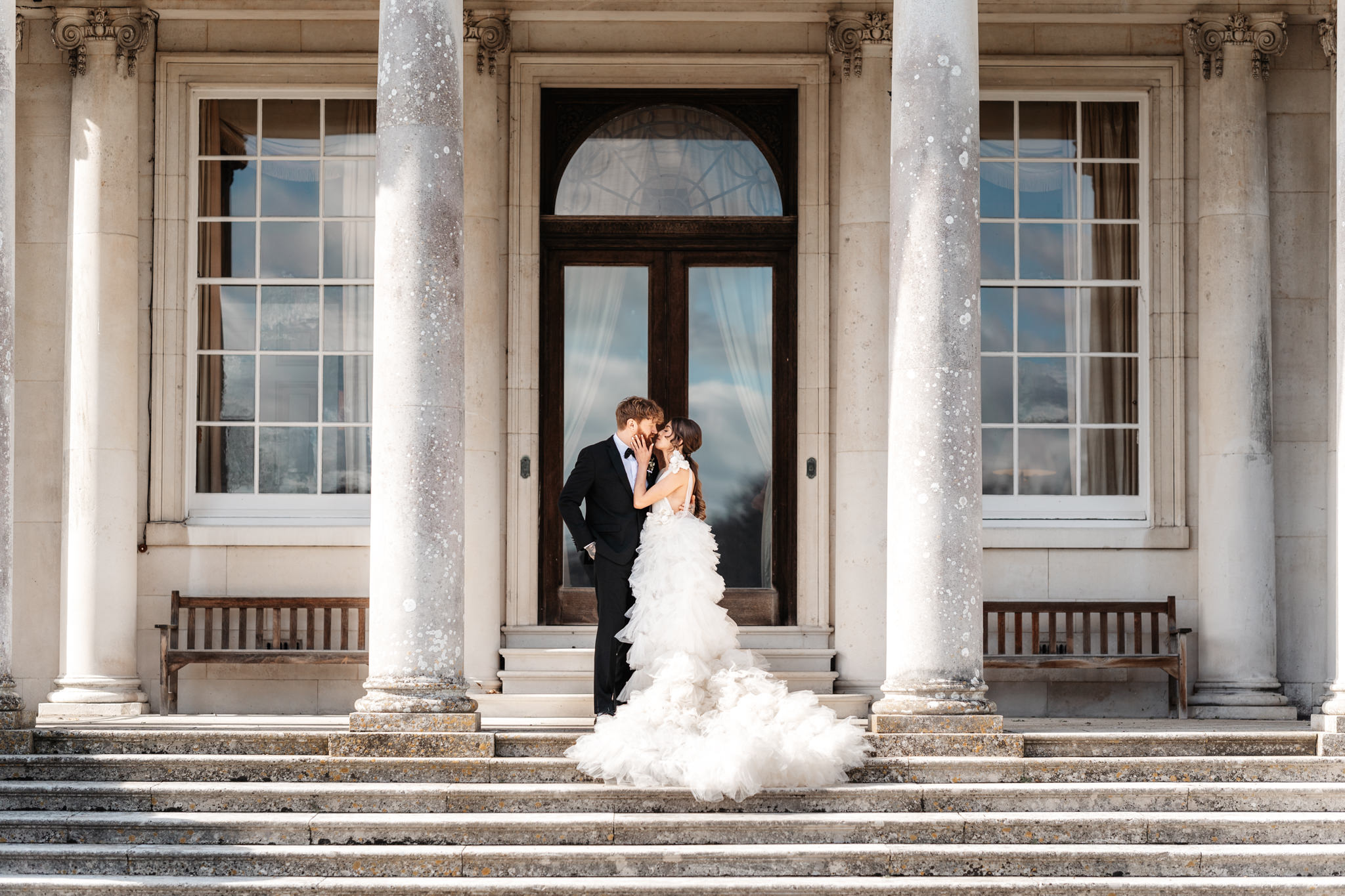 bride and groom wedding portrait outside their wedding venue in hampshire