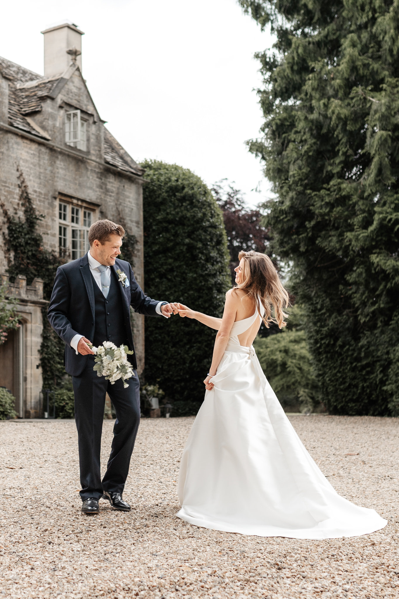 couple portrait outside their wedding venue at barnsley house