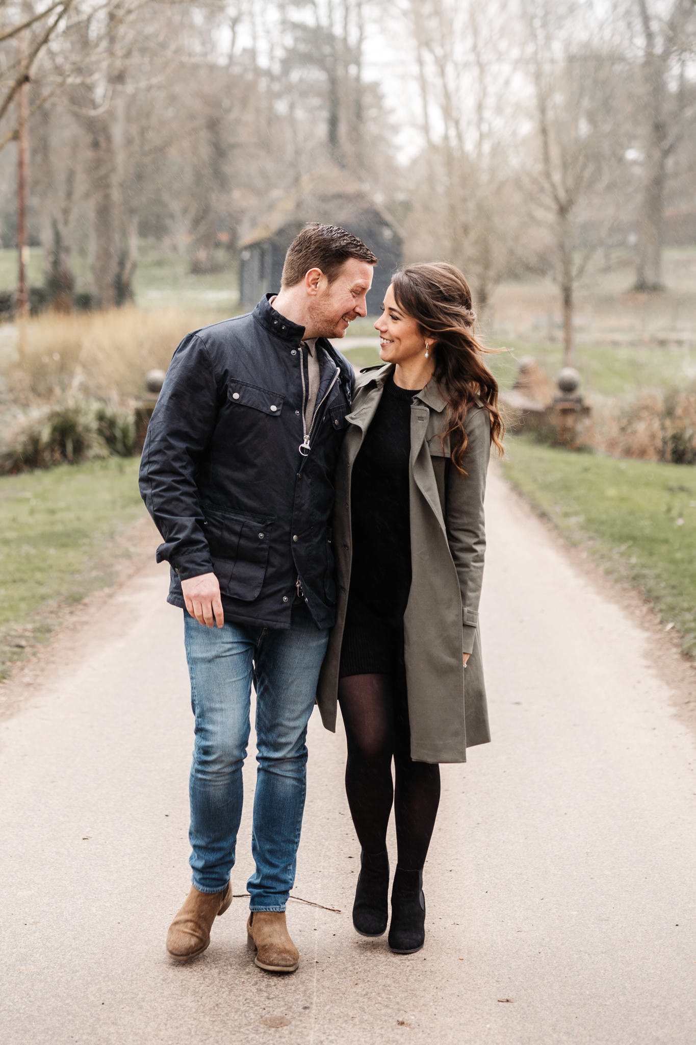engaged couple walking closely during their engagement photography session in hampshire