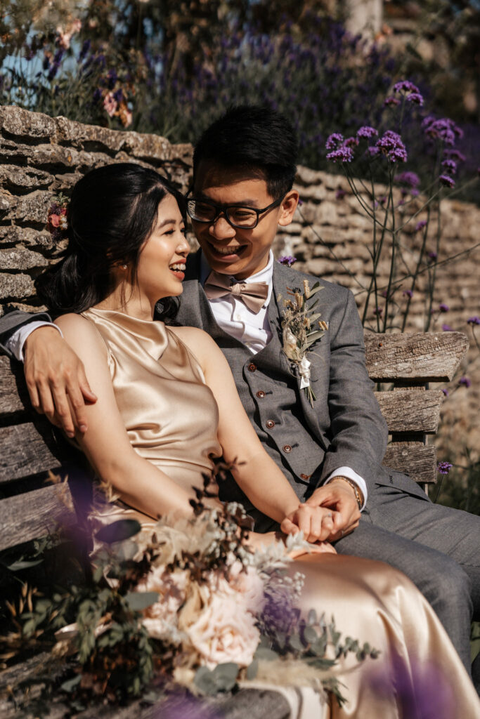 joyful portrait of a couple during their engagement photography session in the cotswolds