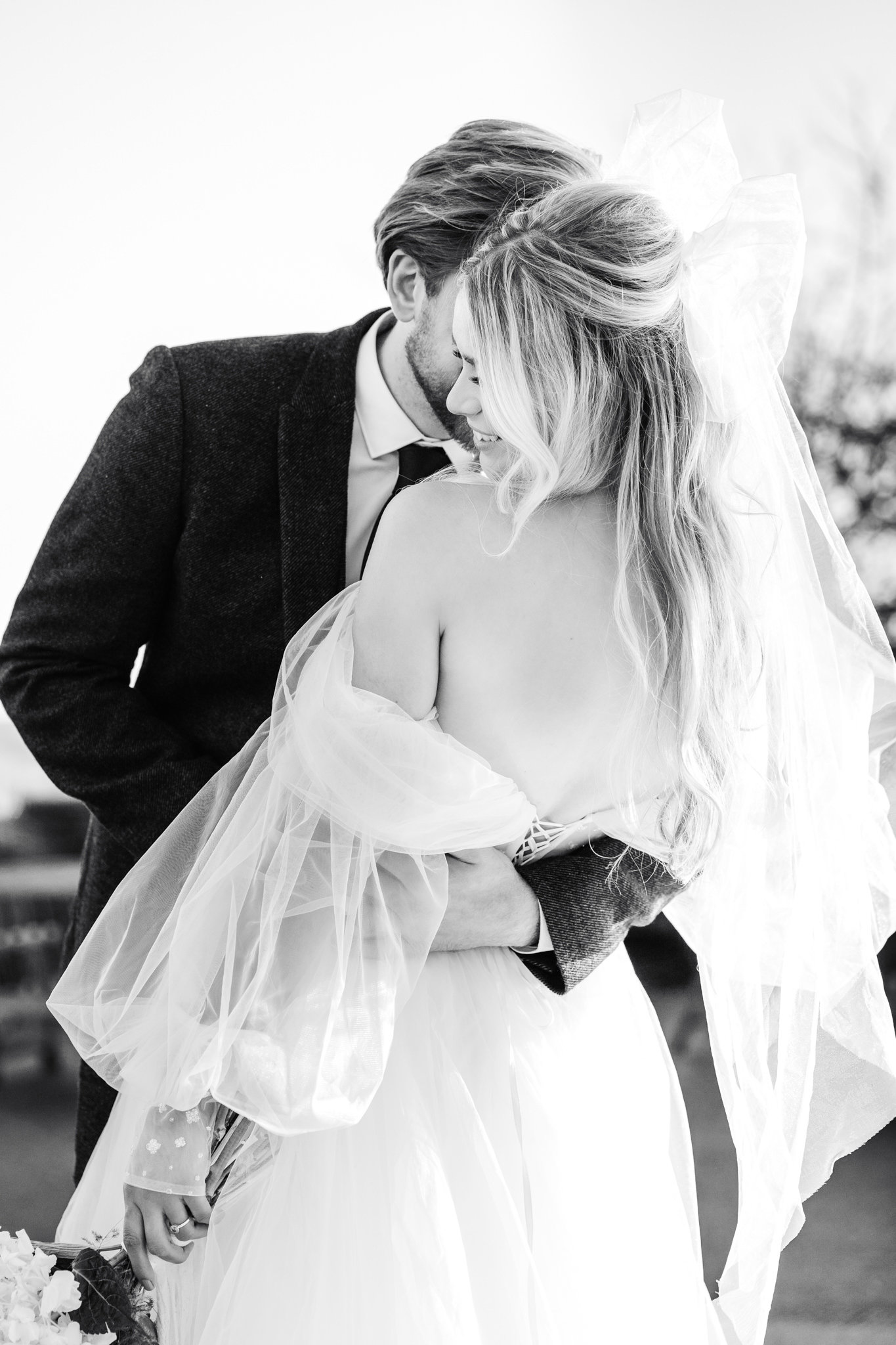 wedding photographer chloe caldwell captures this candid moment between a bride and groom