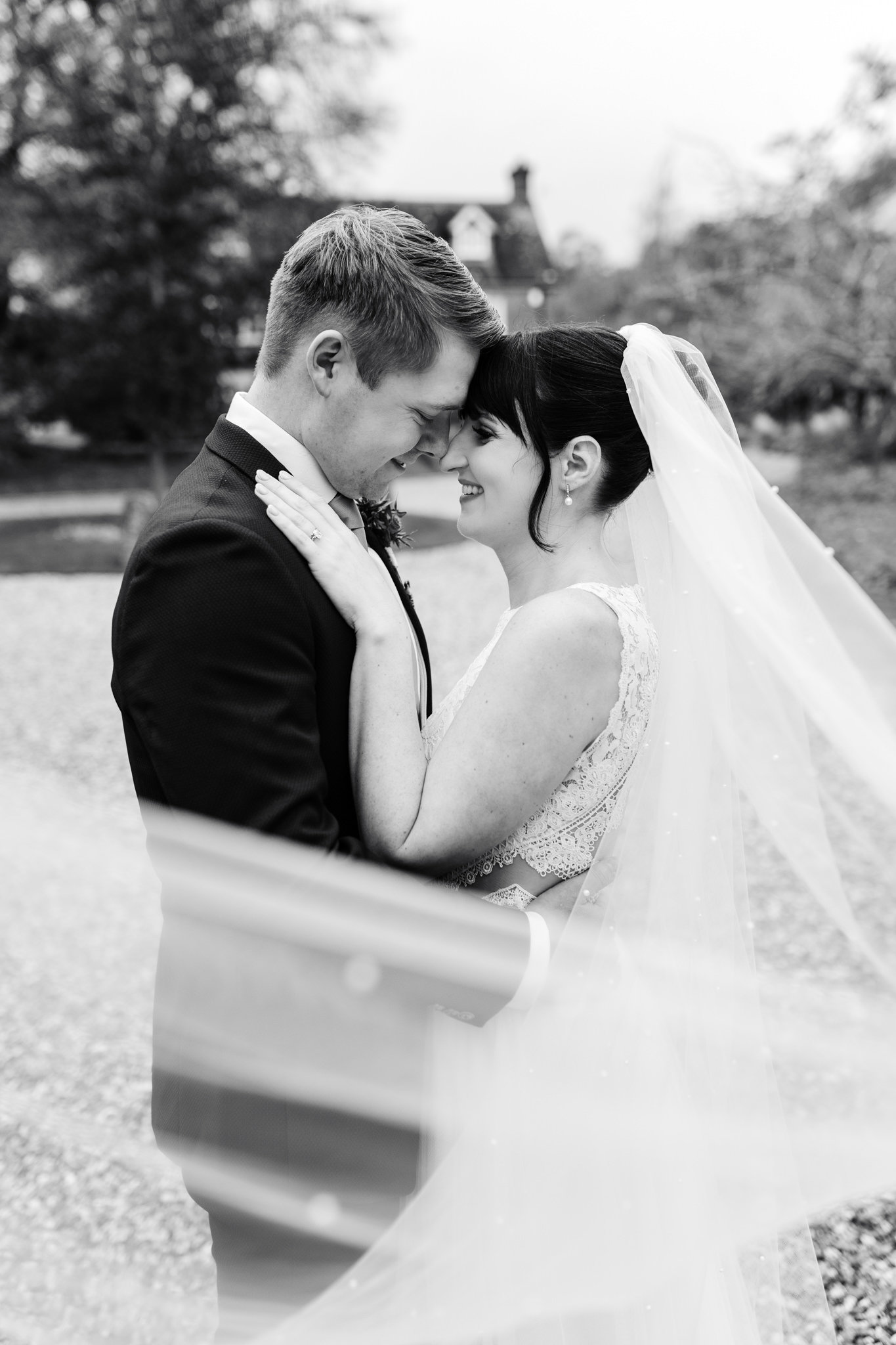 clock barn wedding photo in black and white
