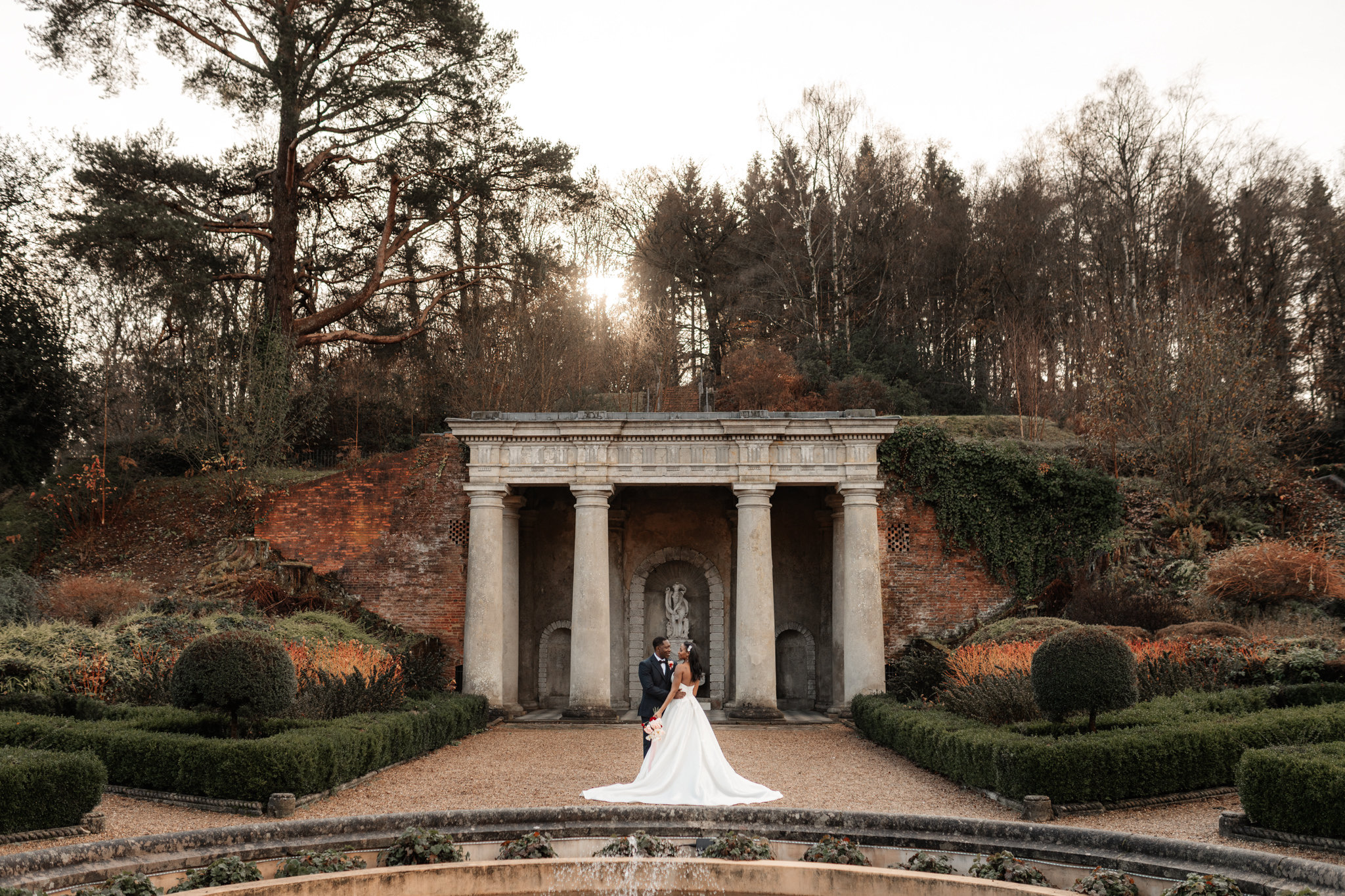 wotton house wedding bride and groom stand in Italian gardens